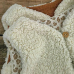 detail-bouton-gilet-bebe