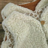 detail-bouton-gilet-bebe