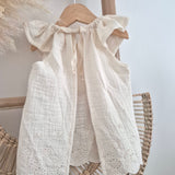 Blouse vanille festonnée dos nu