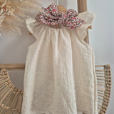 Blouse vanille festonnée dos nu