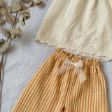 Blouse vanille festonnée dos nu