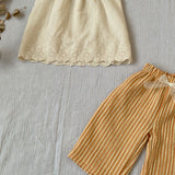 Blouse vanille festonnée dos nu